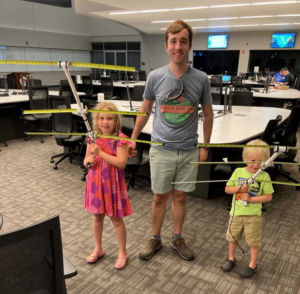 Andrew, N5EI and his children with the completed tape measure Yagis [Dave, KI4PSR]