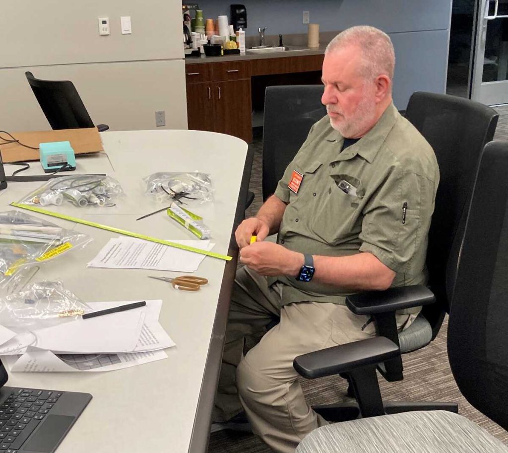 Our EC Jeff, KC1DWP building his tape measure Yagi [Dave, KI4PSR]