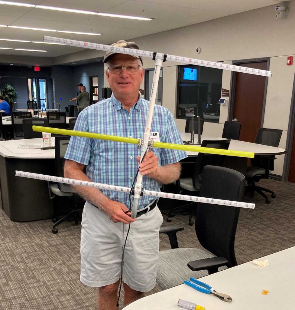 Jim with his completed tape measure Yagi [Dave, KI4PSR]