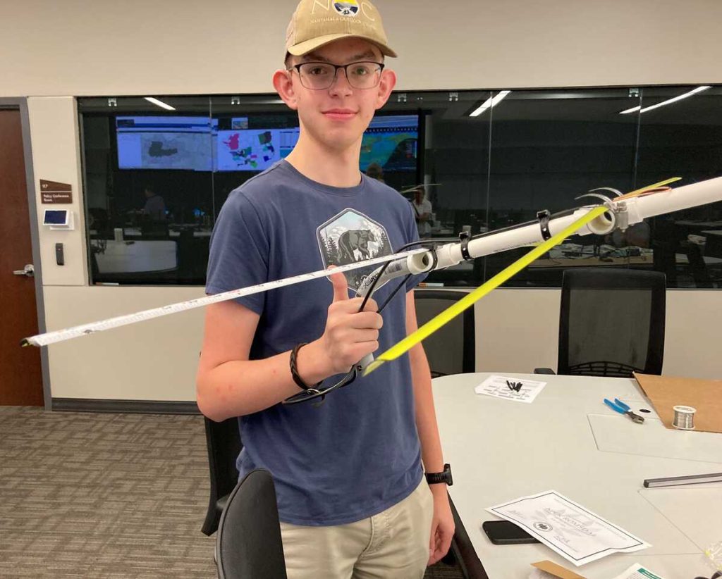 Nick with his completed tape measure Yagi [Dave, KI4PSR]