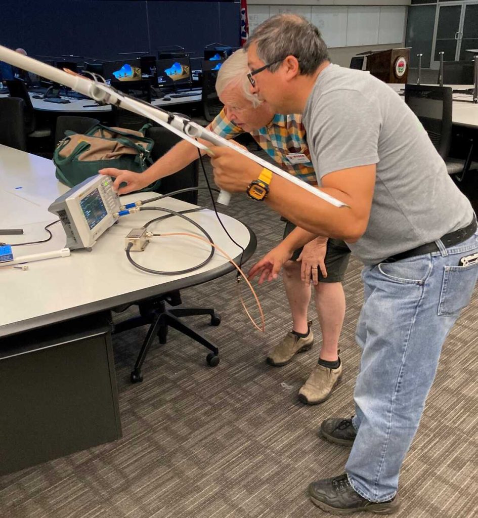 Rene, KM4RGL testing his tape measure Yagi with David, W4DER [Dave, KI4PSR]